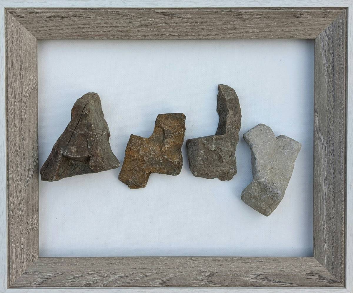 large crystals for home decor displayed on a wooden shelf with morning sunlight highlighting their natural facets
